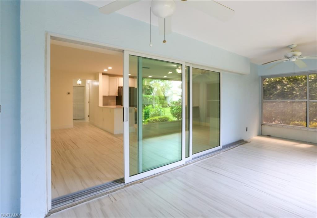225 Georgetown Boulevard Naples, FL 34112 - Photo 17 of 37 Unfurnished sunroom featuring ceiling fan and plenty of natural light
