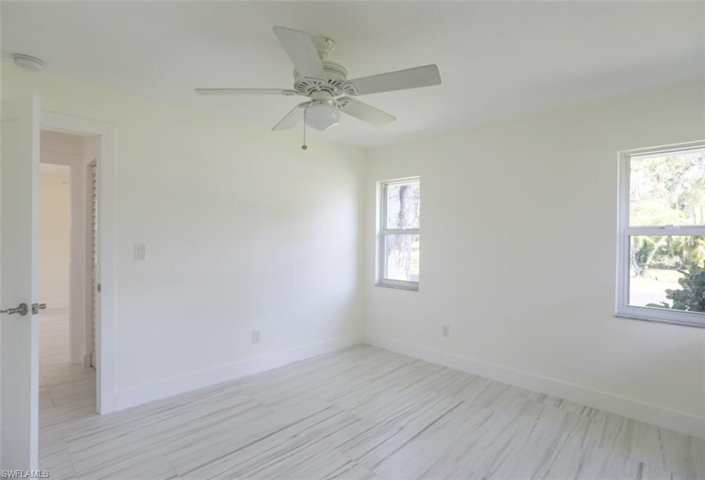 225 Georgetown Boulevard Naples, FL 34112 - Photo 37 of 37 Empty room featuring ceiling fan