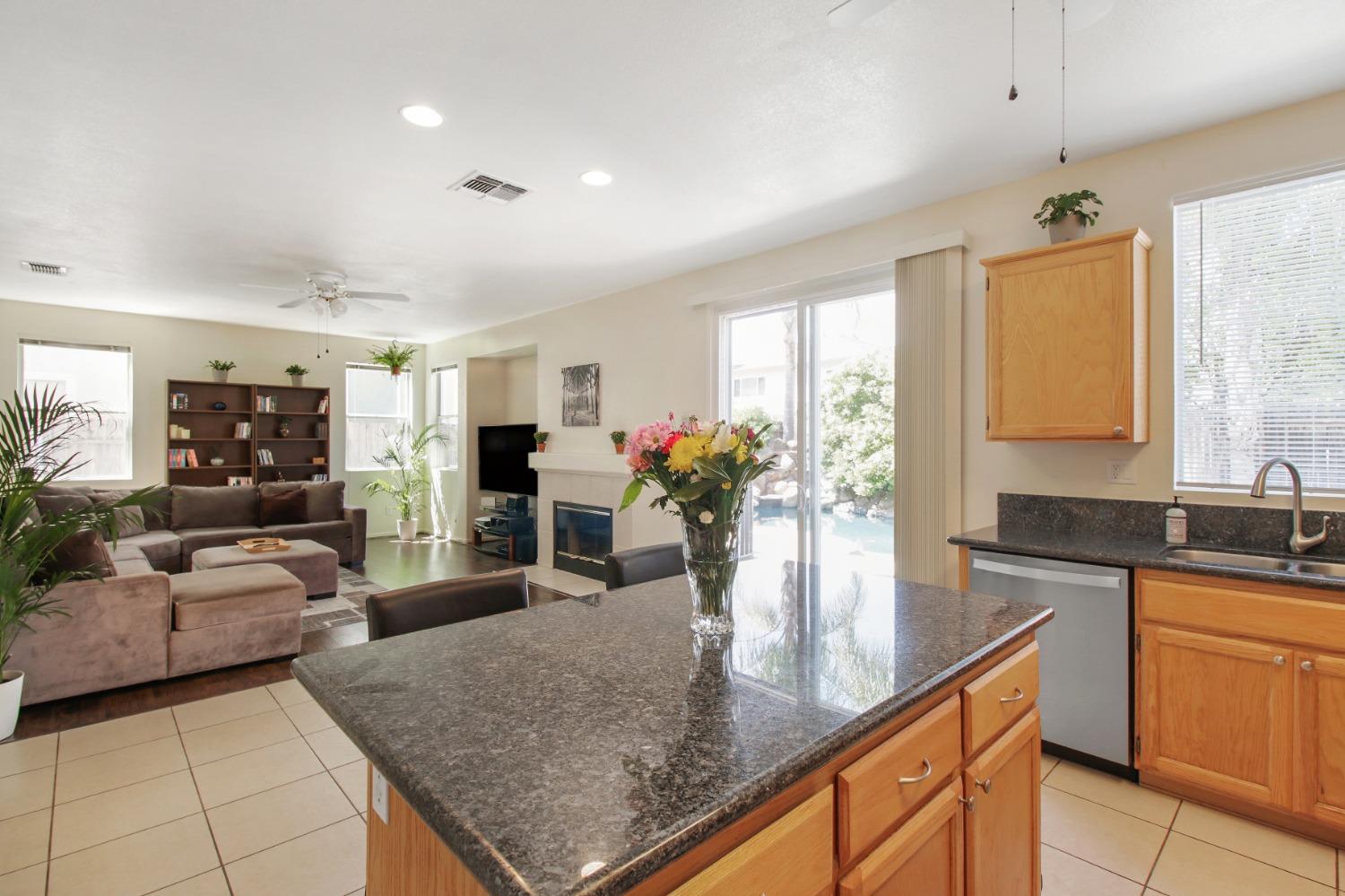 11568 Pyrites Court Gold River, CA 95670 - Photo 20 of 60 a kitchen with granite countertop lots of counter top space