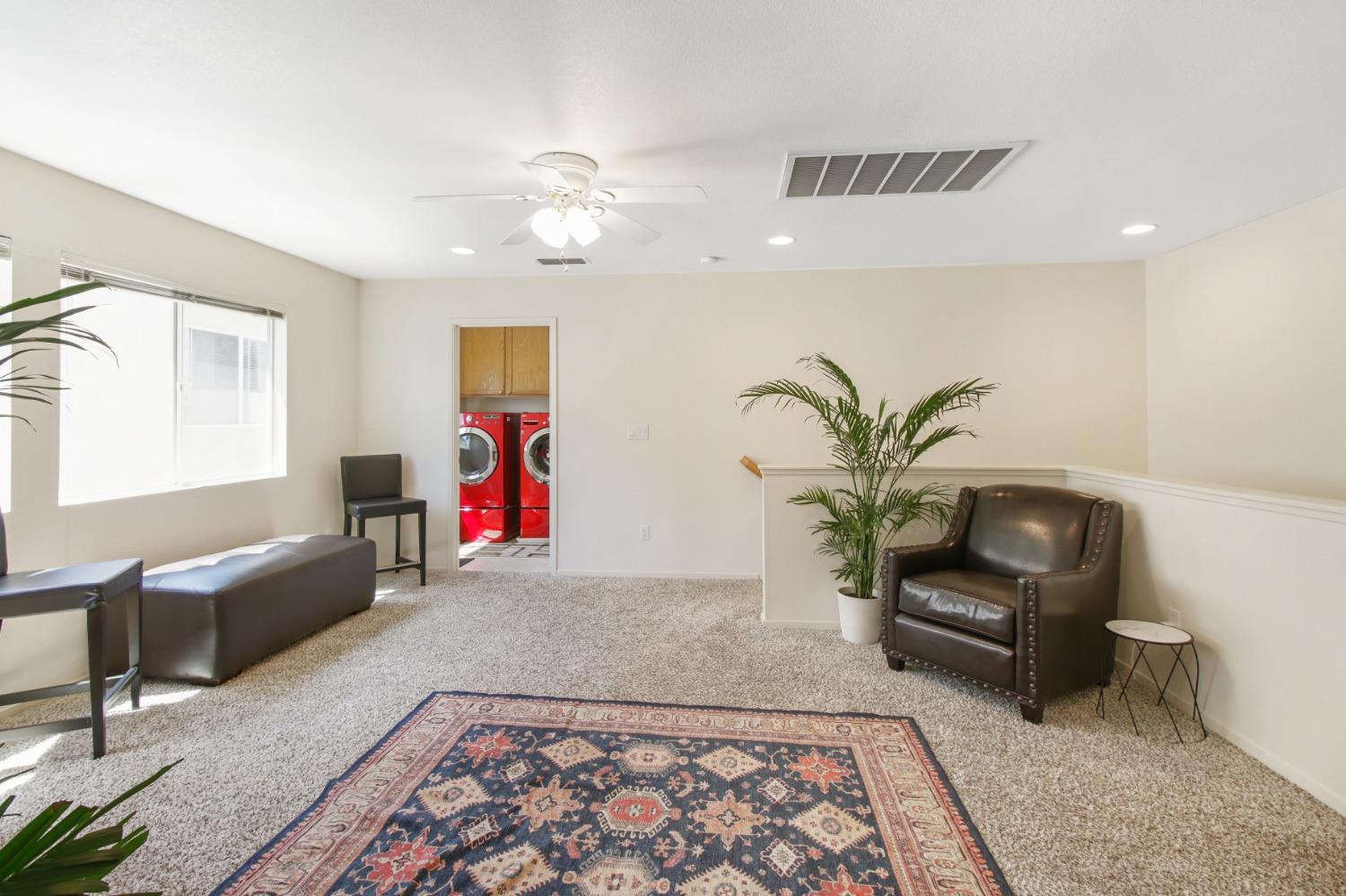 11568 Pyrites Court Gold River, CA 95670 - Photo 23 of 60 a living room with furniture and wooden floor