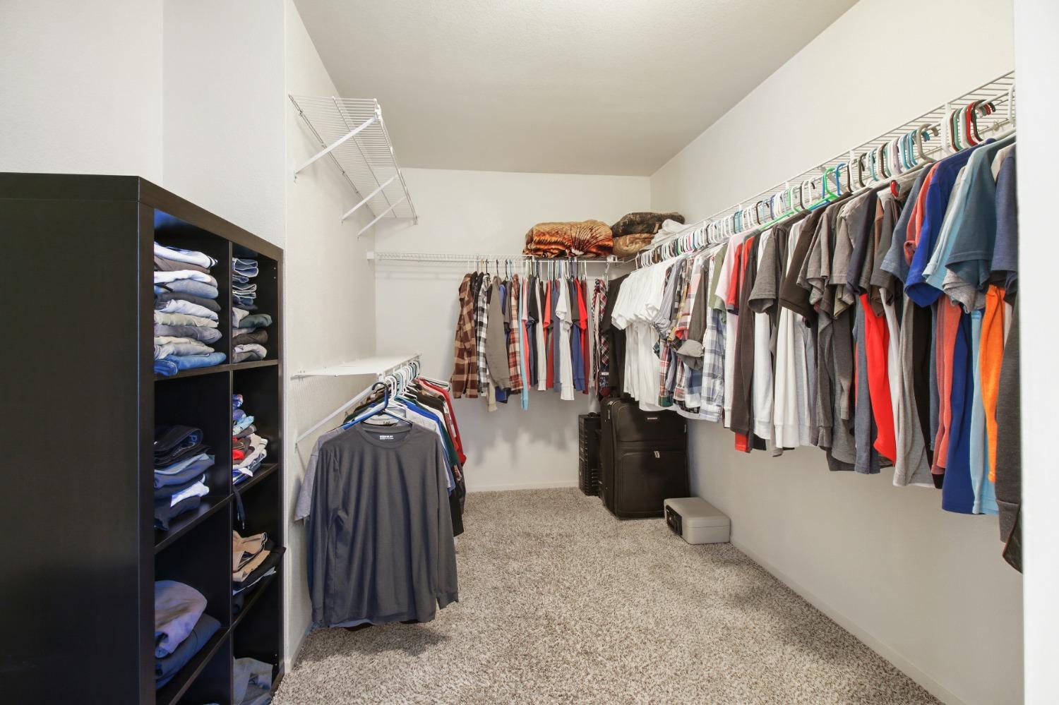 11568 Pyrites Court Gold River, CA 95670 - Photo 31 of 60 a view of walk in closet with clothes