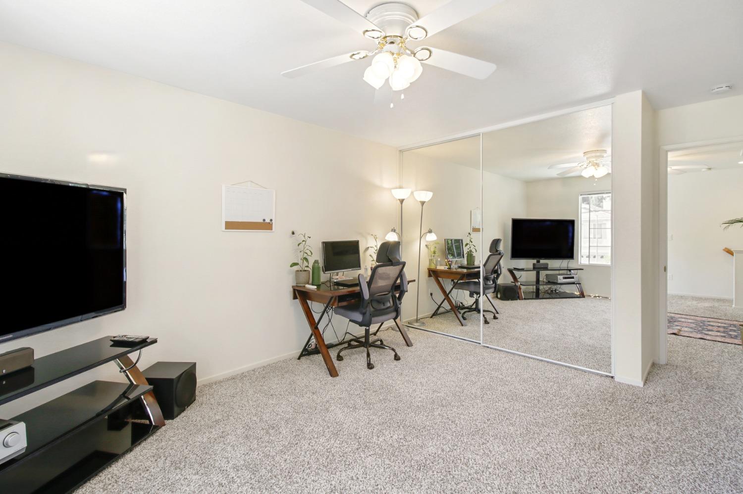 11568 Pyrites Court Gold River, CA 95670 - Photo 33 of 60 a living room with furniture and a flat screen tv