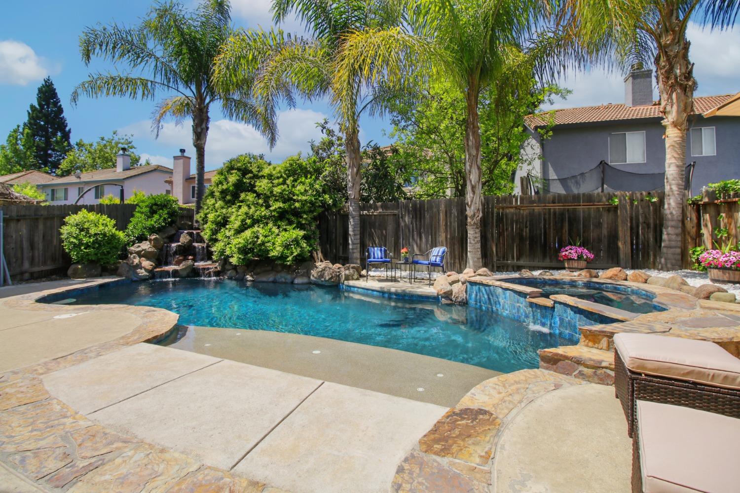 11568 Pyrites Court Gold River, CA 95670 - Photo 41 of 60 a swimming pool with outdoor seating and yard