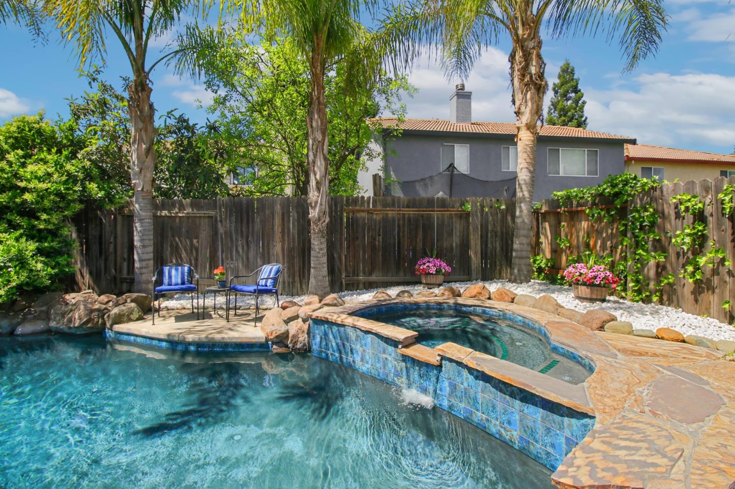 11568 Pyrites Court Gold River, CA 95670 - Photo 43 of 60 a view of a house with pool and chairs