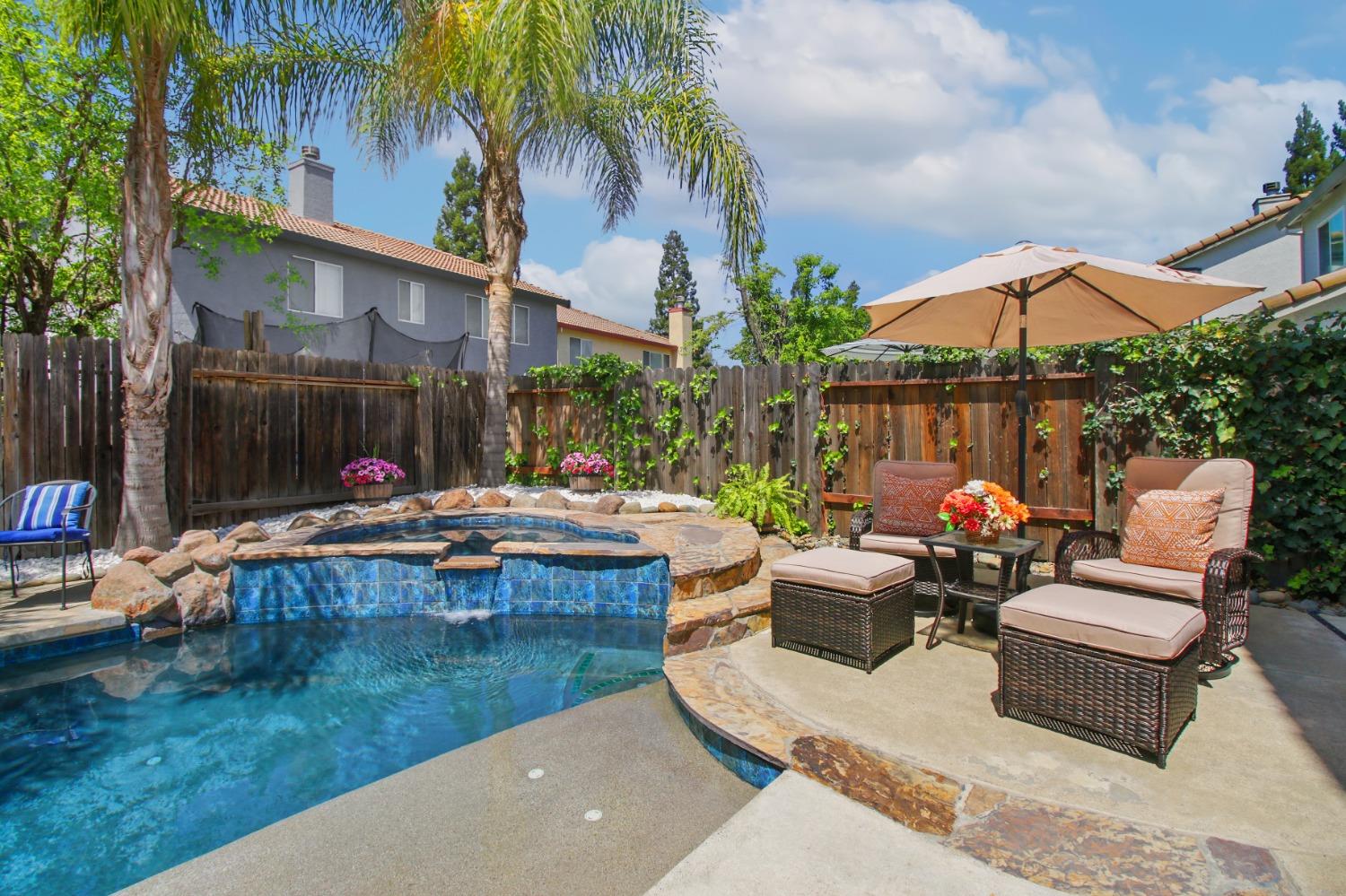 11568 Pyrites Court Gold River, CA 95670 - Photo 44 of 60 a view of a backyard with a patio and swimming pool