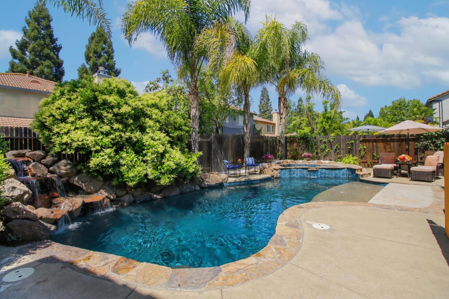 11568 Pyrites Court Gold River, CA 95670 - Photo 47 of 60 a view of a swimming pool with a patio