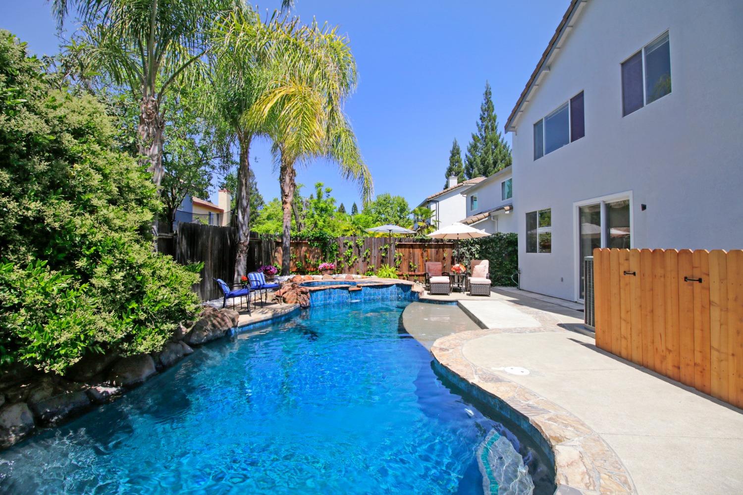 11568 Pyrites Court Gold River, CA 95670 - Photo 48 of 60 a view of a house with swimming pool and sitting area