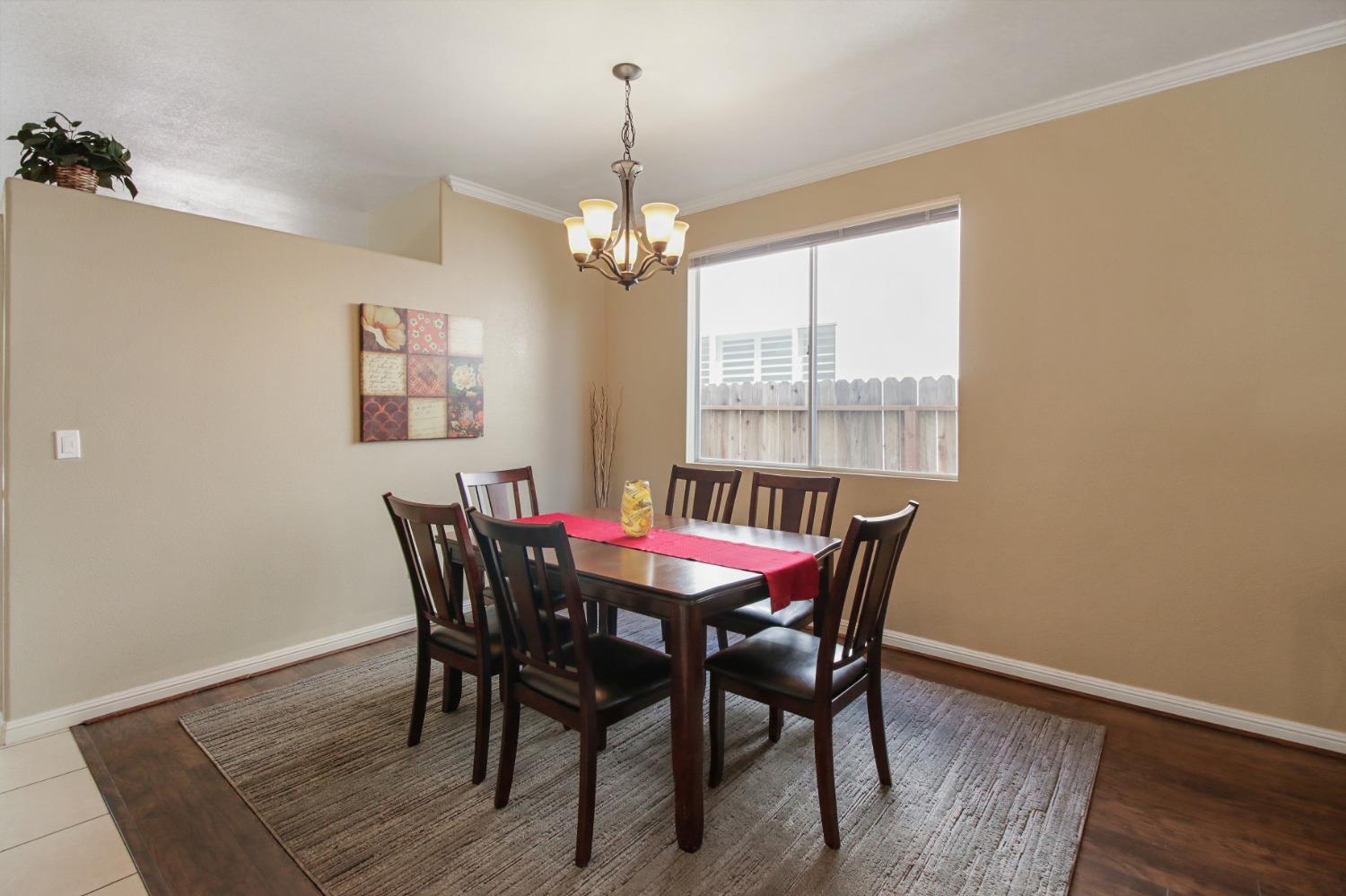 11568 Pyrites Court Gold River, CA 95670 - Photo 7 of 60 a view of a dining room with furniture window and wooden floor