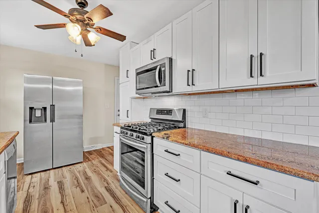 a bedroom with a bed and a table in it