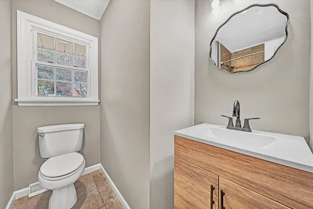 a bathroom with a shower and toilet