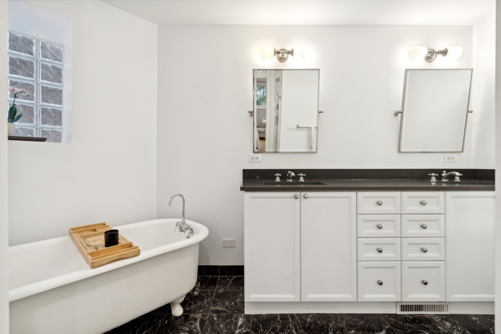 2027 North Howe Street, Unit 1 Chicago, IL 60614 - Photo 15 of 28 a bathroom with a granite countertop sink and a mirror