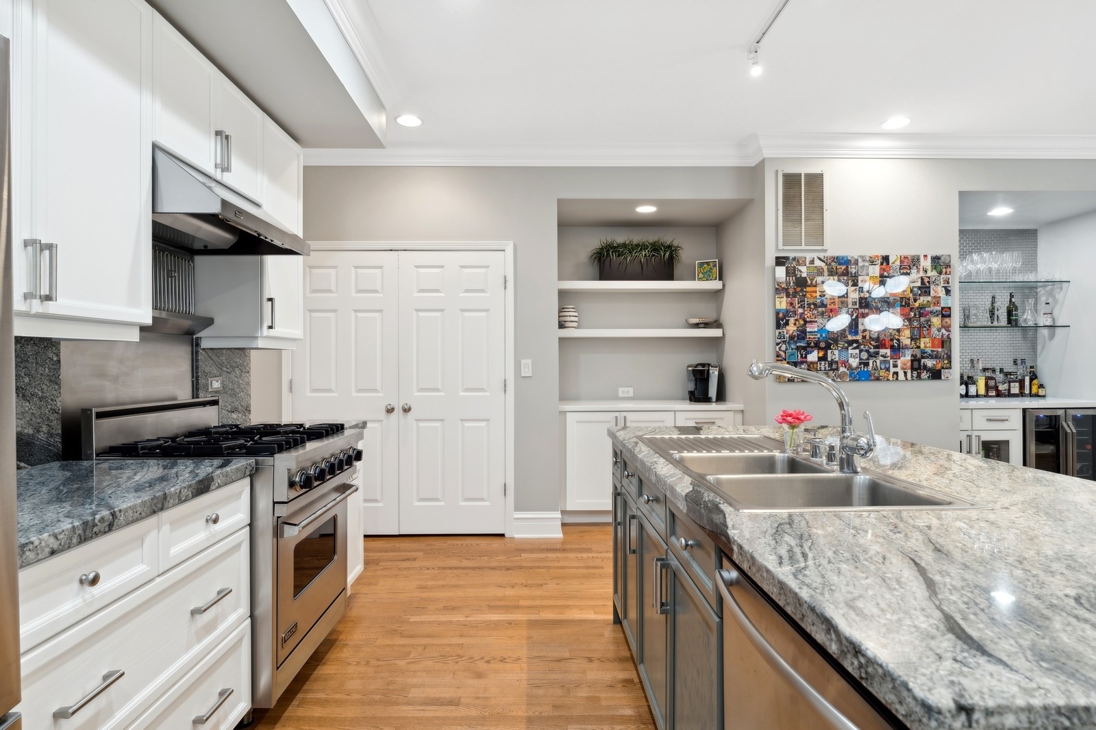 2027 North Howe Street, Unit 1 Chicago, IL 60614 - Photo 6 of 28 a kitchen with stainless steel appliances granite countertop a sink stove and cabinets
