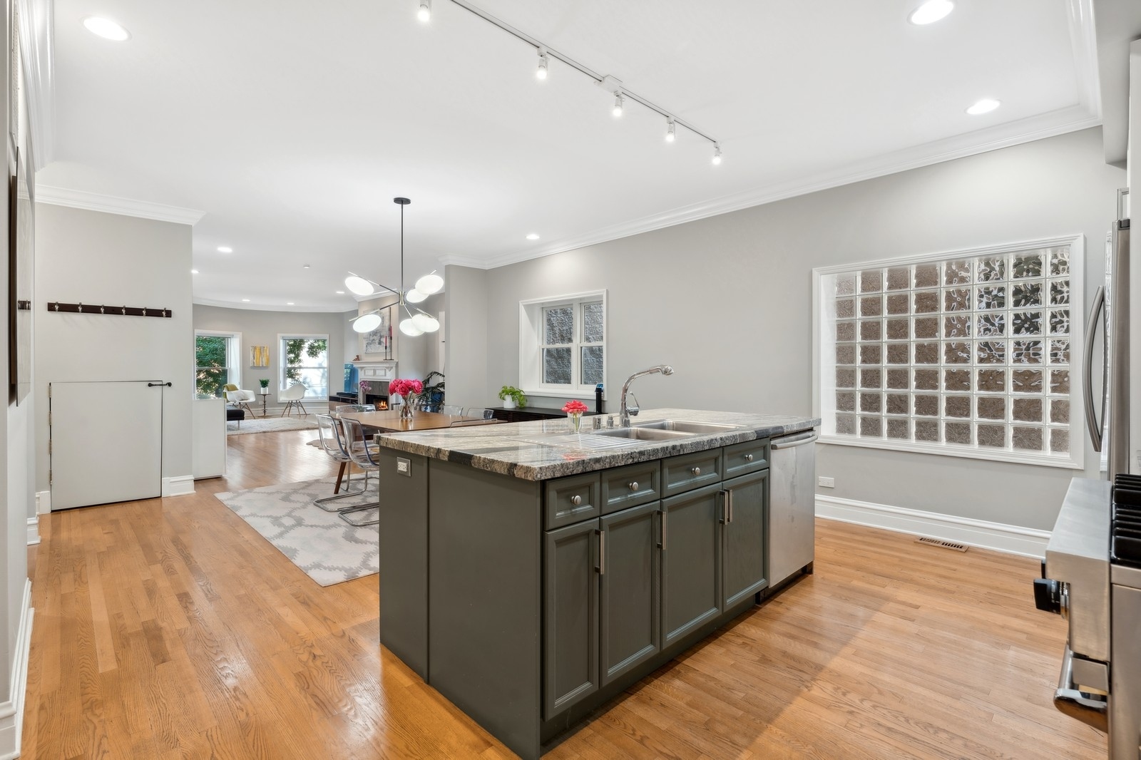 2027 North Howe Street, Unit 1 Chicago, IL 60614 - Photo 7 of 28 a kitchen with stainless steel appliances granite countertop a sink and a stove