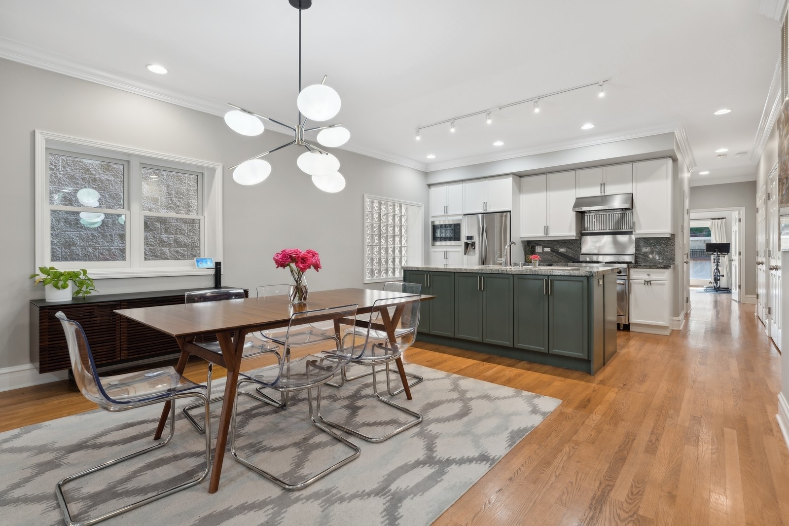 2027 North Howe Street, Unit 1 Chicago, IL 60614 - Photo 8 of 28 a view of a dining room with furniture window and wooden floor