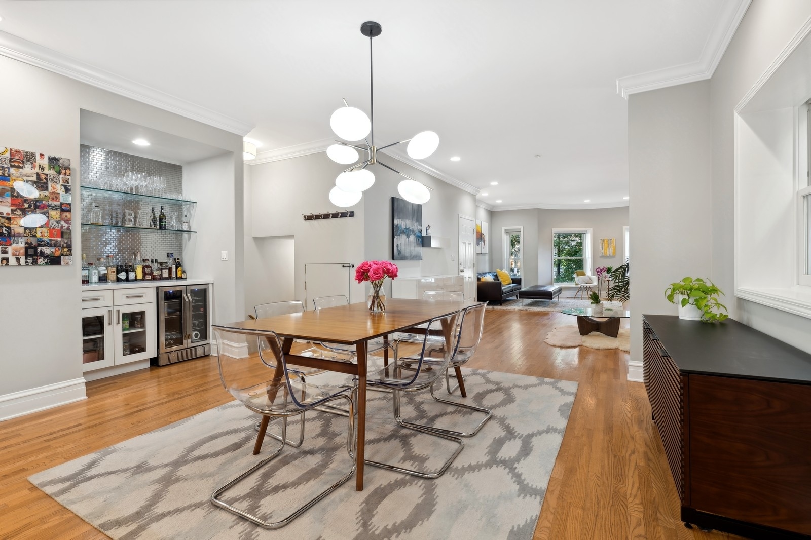 2027 North Howe Street, Unit 1 Chicago, IL 60614 - Photo 9 of 28 a view of a dining room with furniture and wooden floor