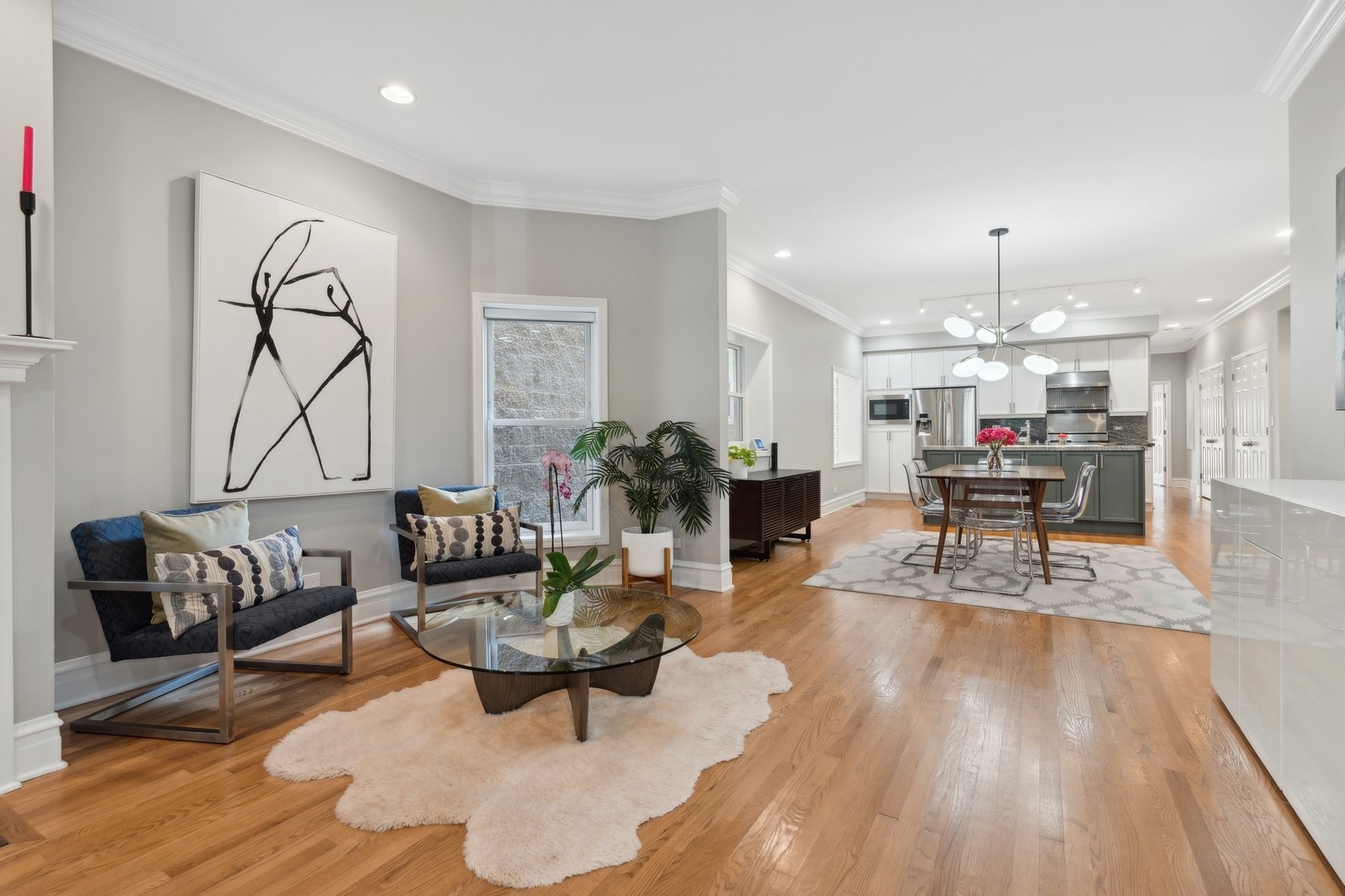 2027 North Howe Street, Unit 1 Chicago, IL 60614 - Photo 10 of 28 a living room with furniture and a chandelier