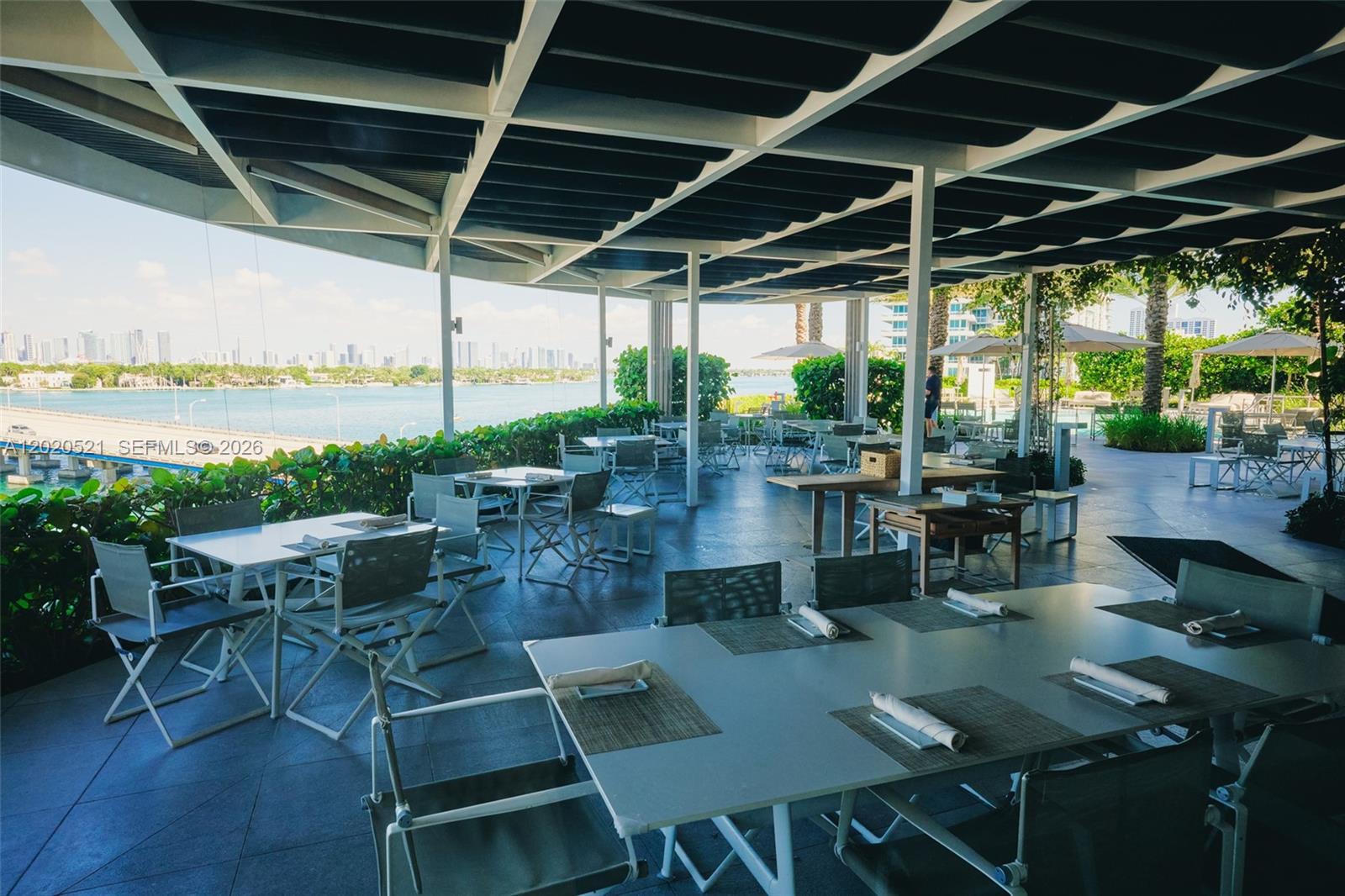 450 Alton Road, Unit 2810 Miami Beach, FL 33139 - Photo 29 of 29 a view of a patio with chairs and table in patio