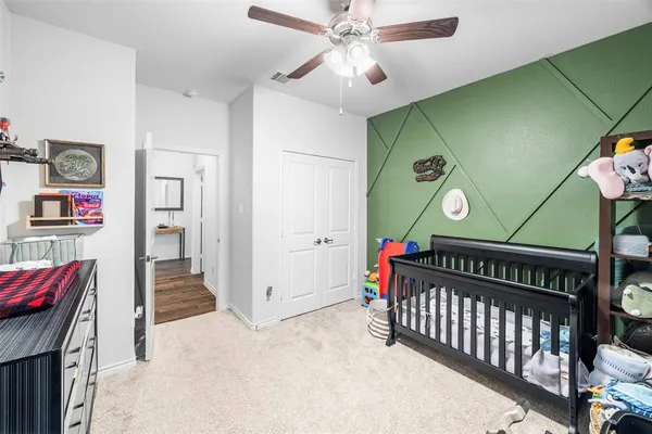 a bedroom with furniture and a window