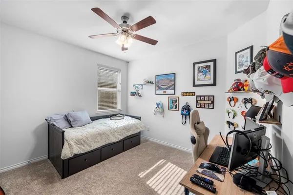 a bedroom with bed and a window