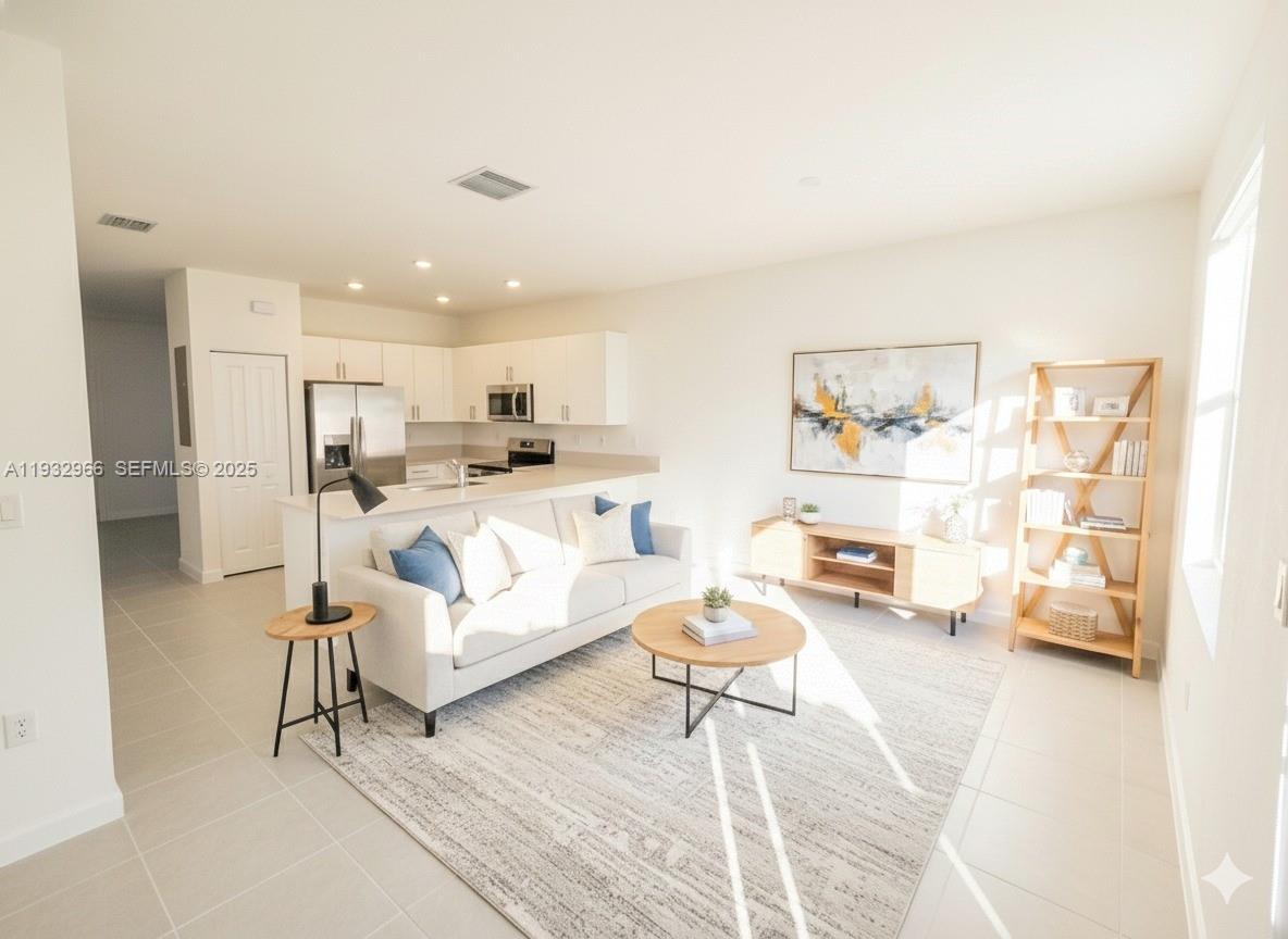 12136 Southwest 268th Street Homestead, FL 33032 - Photo 11 of 11 a living room with furniture and a couch