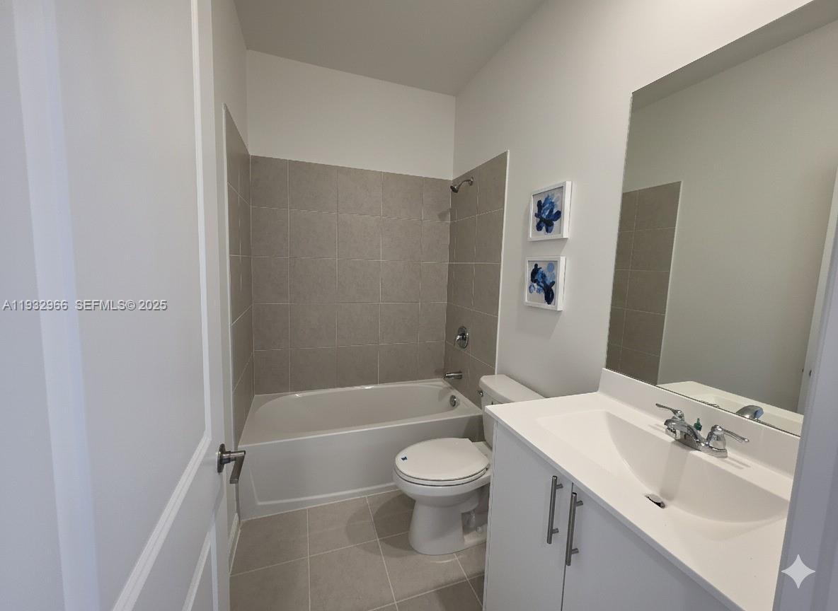 12136 Southwest 268th Street Homestead, FL 33032 - Photo 10 of 11 a bathroom with a sink a toilet and shower