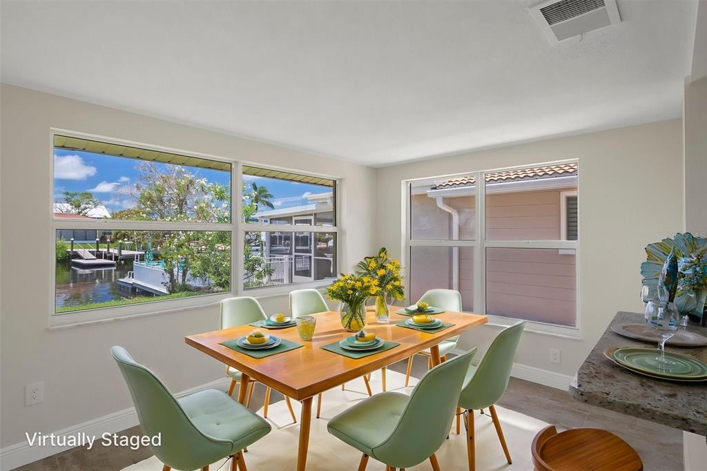 a view of a dining room with furniture window and outside view