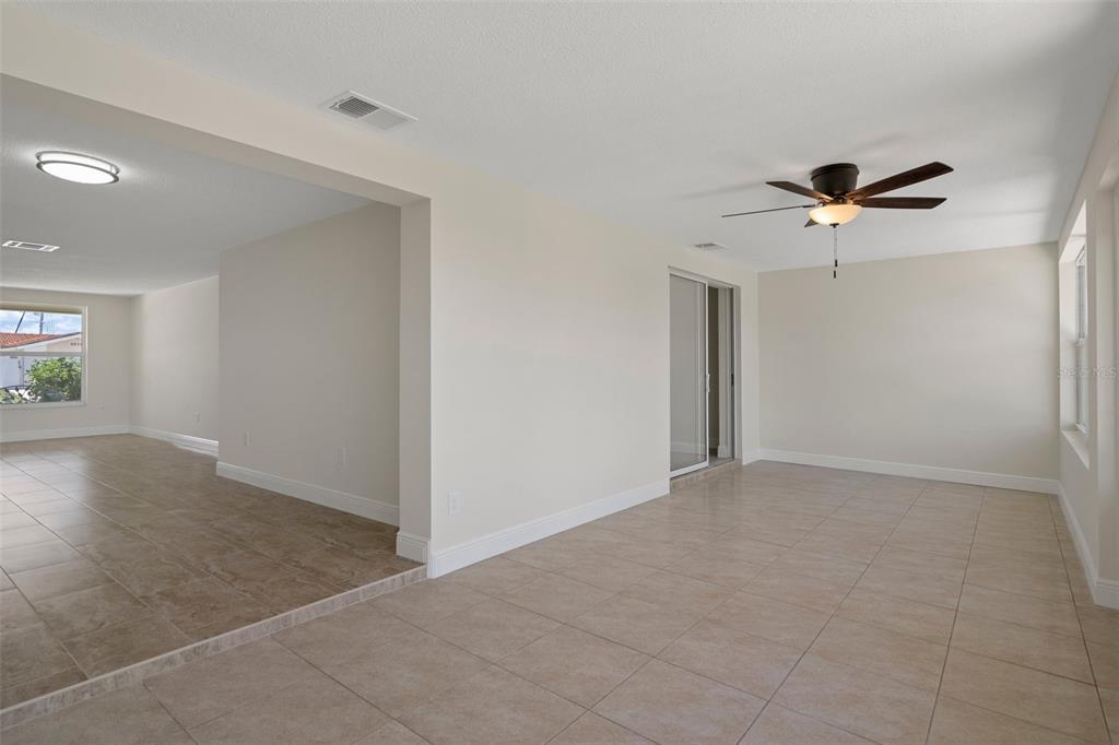 4937 Dory Drive New Port Richey, FL 34652 - Photo 36 of 68 wooden floor in an empty room with a window