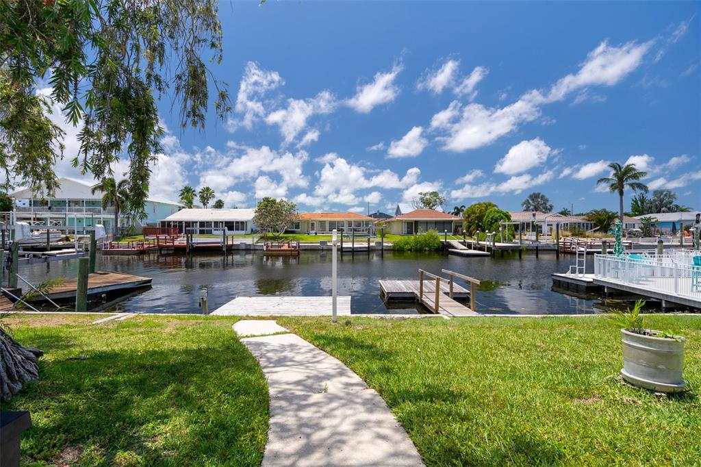4937 Dory Drive New Port Richey, FL 34652 - Photo 40 of 68 a swimming pool with outdoor seating and lake view