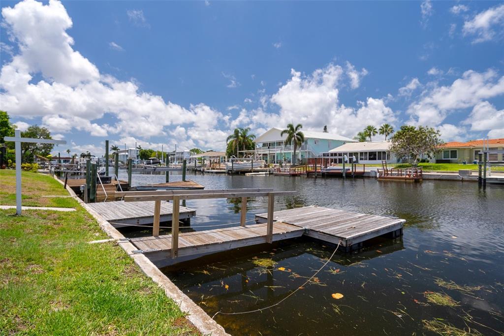 4937 Dory Drive New Port Richey, FL 34652 - Photo 45 of 68 a view of a lake with a house in the background