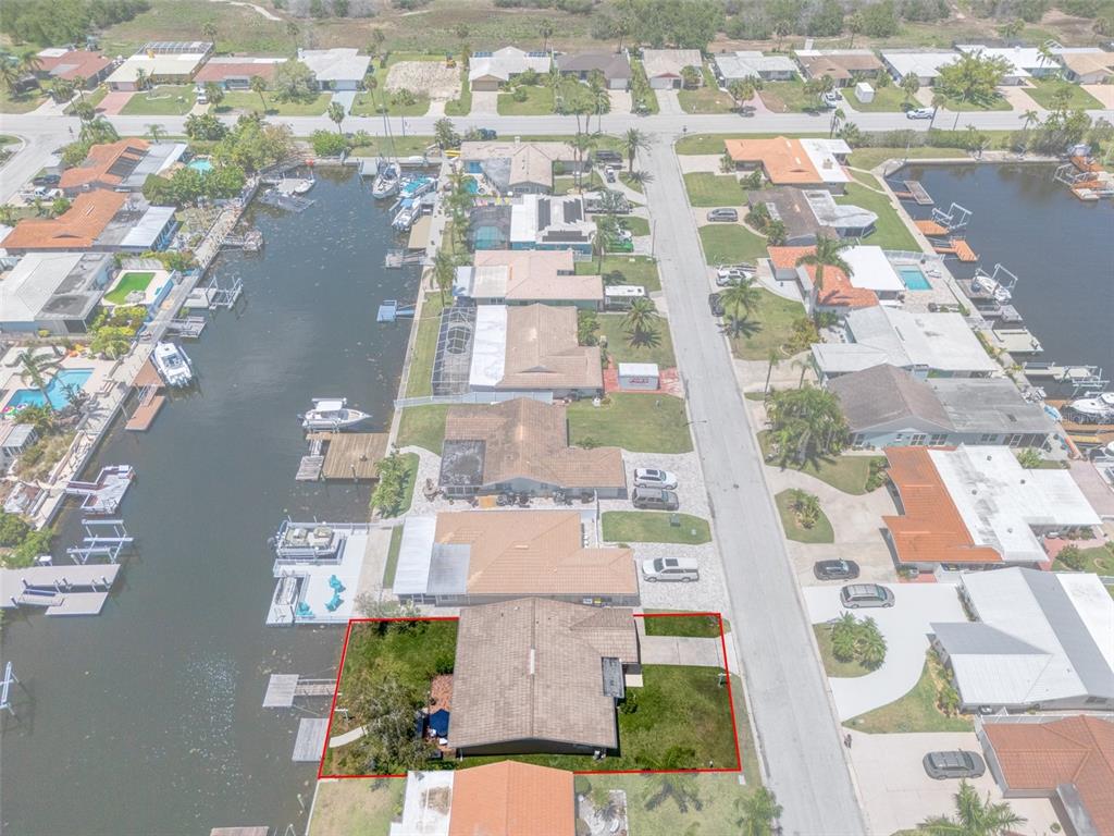 4937 Dory Drive New Port Richey, FL 34652 - Photo 46 of 68 an aerial view of residential houses with outdoor space