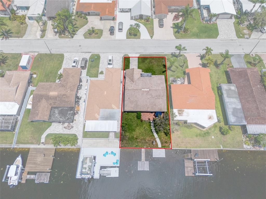 4937 Dory Drive New Port Richey, FL 34652 - Photo 48 of 68 an aerial view of a house with a yard