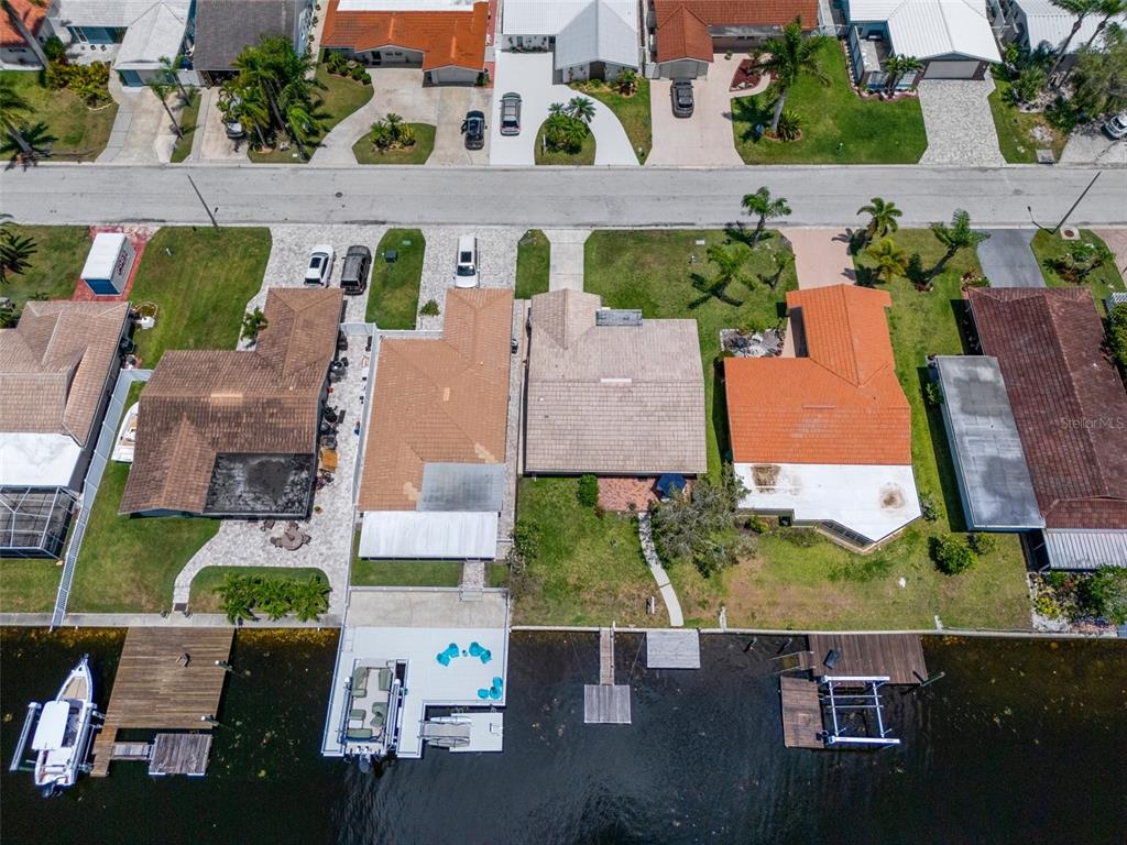 4937 Dory Drive New Port Richey, FL 34652 - Photo 50 of 68 an aerial view of multiple houses with outdoor space