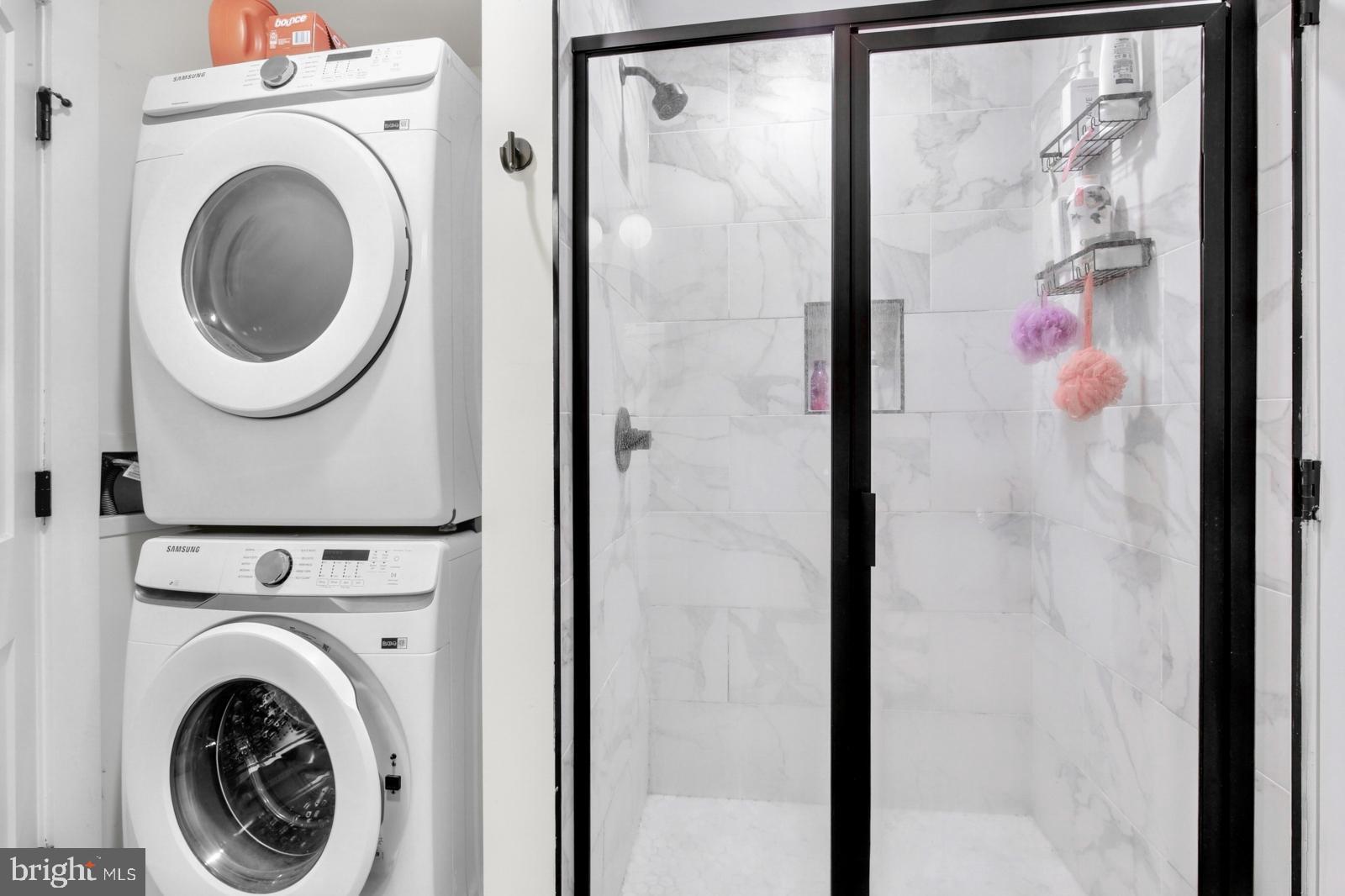 1415 Locust Street, Unit 201 Philadelphia, PA 19102 - Photo 12 of 20 a view of a bathroom with a washer and dryer