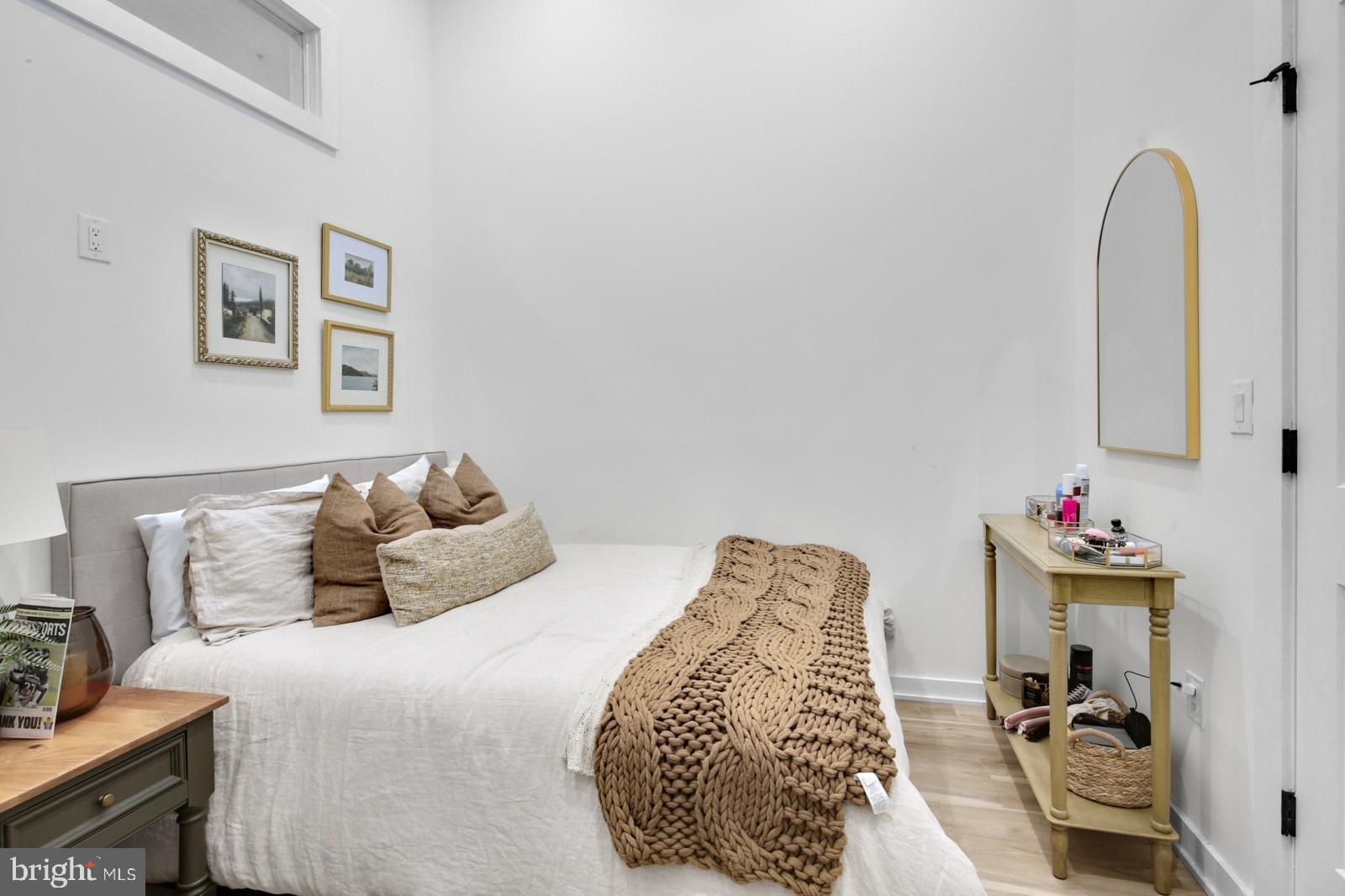 1415 Locust Street, Unit 201 Philadelphia, PA 19102 - Photo 13 of 20 a bedroom with a bed and a chair