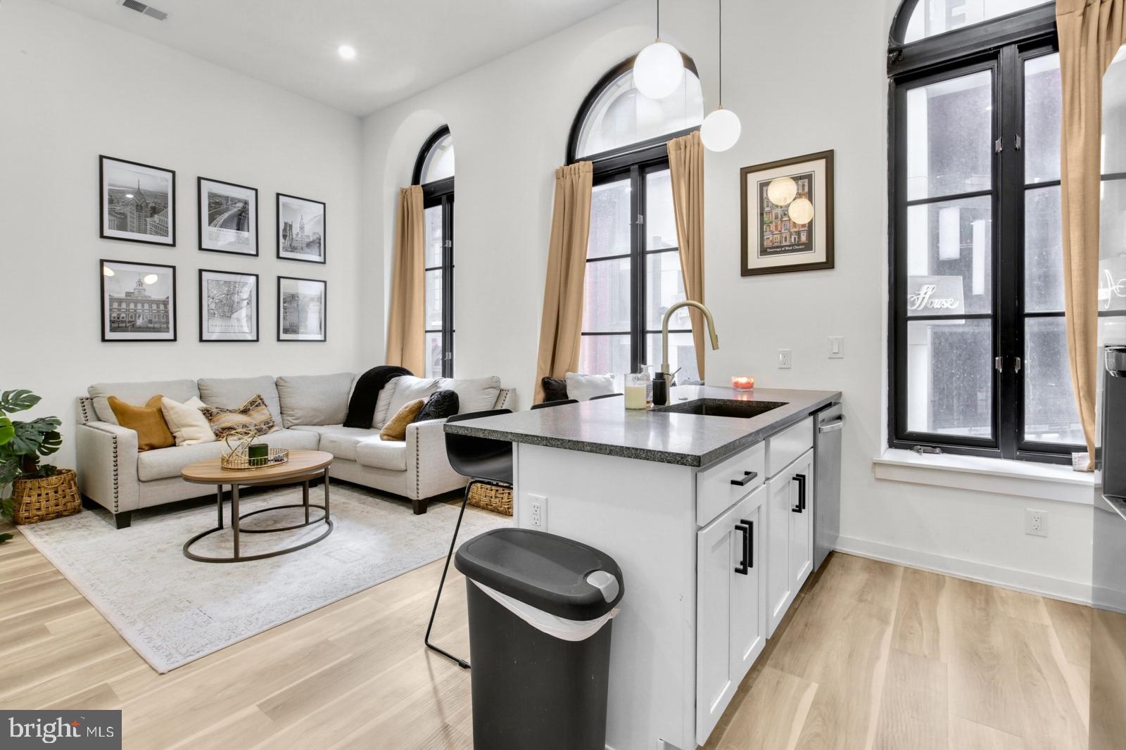 1415 Locust Street, Unit 201 Philadelphia, PA 19102 - Photo 6 of 20 a living room with granite countertop furniture and a window