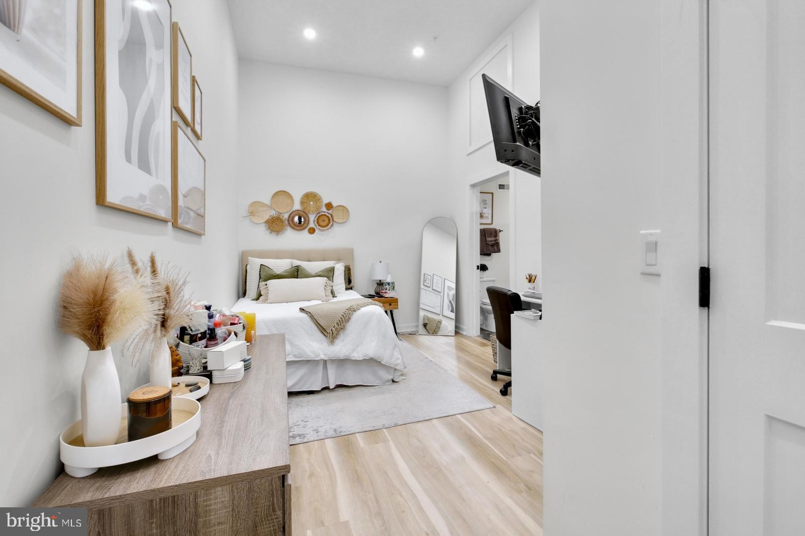 1415 Locust Street, Unit 201 Philadelphia, PA 19102 - Photo 8 of 20 a living room with furniture and a flat screen tv