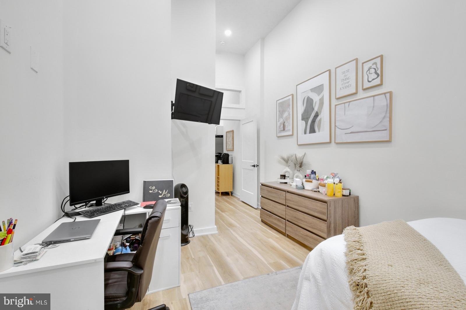 1415 Locust Street, Unit 201 Philadelphia, PA 19102 - Photo 10 of 20 a bedroom with a bed and a flat screen tv