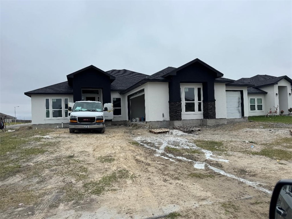 1469 Dragonstone Court Corpus Christi, TX 78415 - Photo 1 of 3 a car parked in front of white house