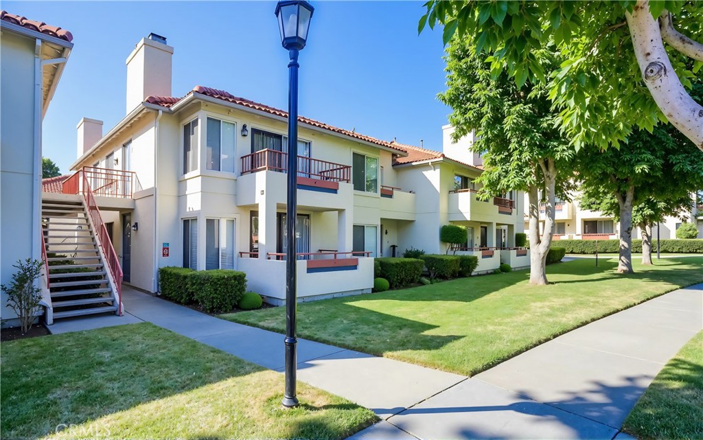 445 Ribbon Beach Way, Unit 278 Oceanside, CA 92058 - Photo 18 of 19 a front view of a house with a yard
