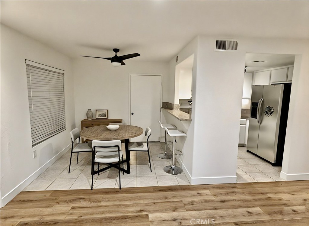 445 Ribbon Beach Way, Unit 278 Oceanside, CA 92058 - Photo 2 of 19 a view of a dining room with furniture and a rug