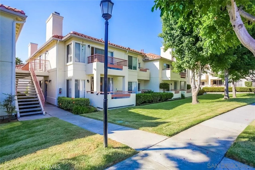 445 Ribbon Beach Way, Unit 278 Oceanside, CA 92058 - Photo 6 of 19 a front view of a house with a yard