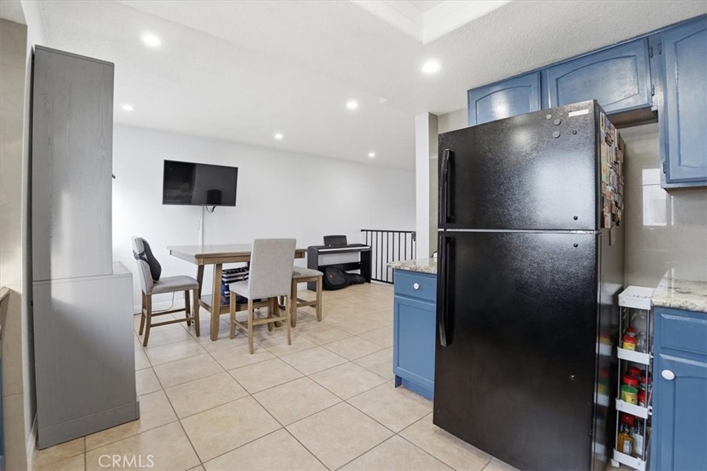 14325 Foothill Boulevard, Unit 9 Sylmar, CA 91342 - Photo 14 of 43 a kitchen with stainless steel appliances granite countertop a refrigerator and a stove top oven