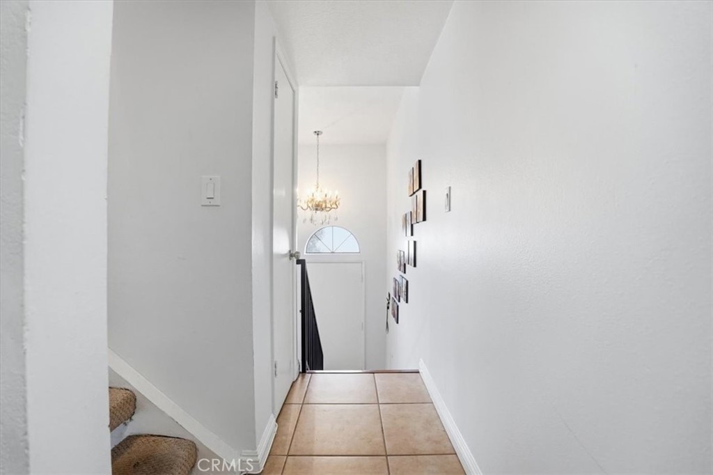 14325 Foothill Boulevard, Unit 9 Sylmar, CA 91342 - Photo 15 of 43 a view of a hallway with white walls