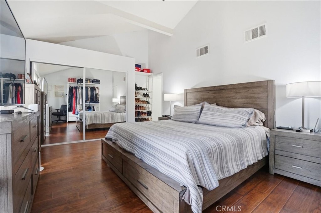 14325 Foothill Boulevard, Unit 9 Sylmar, CA 91342 - Photo 19 of 43 a spacious bedroom with a bed and a large mirror