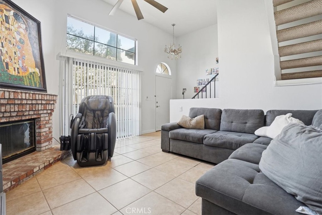 14325 Foothill Boulevard, Unit 9 Sylmar, CA 91342 - Photo 2 of 43 a living room with furniture a fireplace and a large window