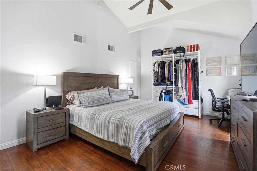 14325 Foothill Boulevard, Unit 9 Sylmar, CA 91342 - Photo 21 of 43 a bedroom with a bed and a desk