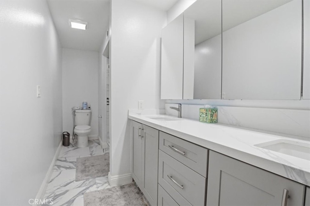14325 Foothill Boulevard, Unit 9 Sylmar, CA 91342 - Photo 24 of 43 a spacious bathroom with a sink and a mirror