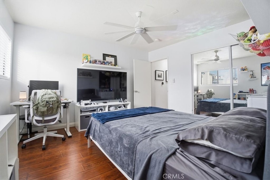 14325 Foothill Boulevard, Unit 9 Sylmar, CA 91342 - Photo 25 of 43 a bedroom with a bed and a chandelier