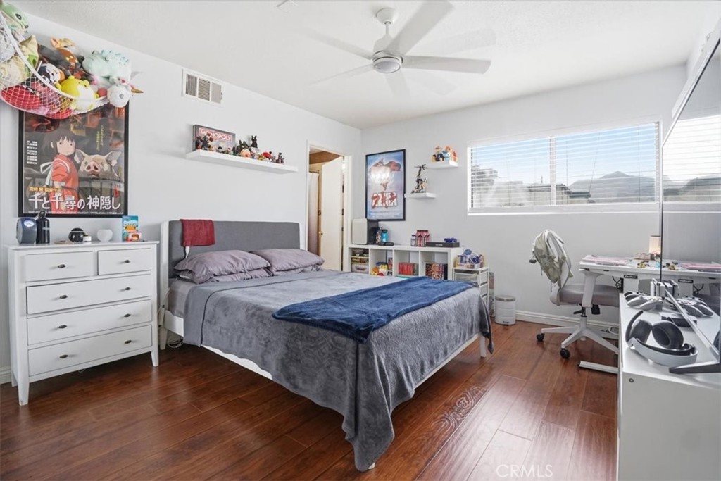 14325 Foothill Boulevard, Unit 9 Sylmar, CA 91342 - Photo 26 of 43 a view of a bedroom with furniture and toys