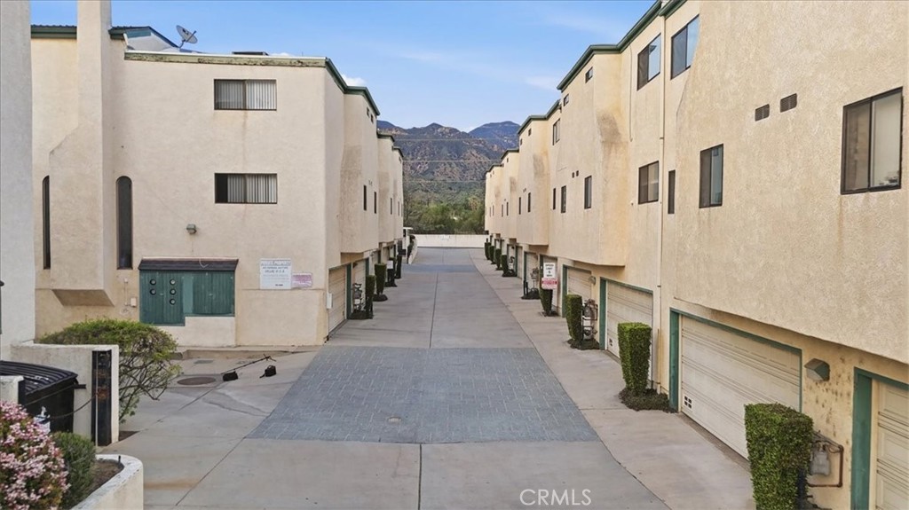 14325 Foothill Boulevard, Unit 9 Sylmar, CA 91342 - Photo 34 of 43 a view of a white building with many windows